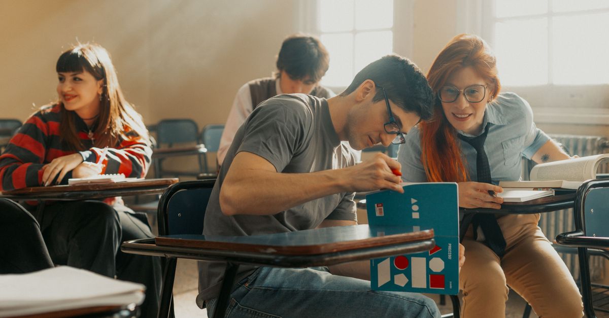 University students studying together in a sunlit classroom in Buenos Aires, Argentina.